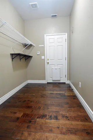 a view of a room that has wooden floor in it