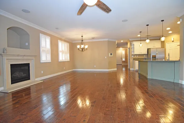 wooden floor in an empty room with a fireplace