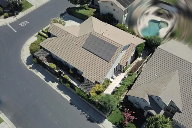 an aerial view of a house with outdoor space