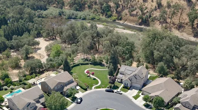 an aerial view of a house with a garden