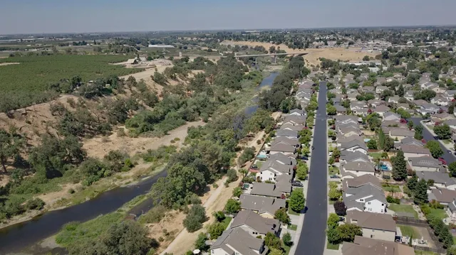 a view of a lake with a house
