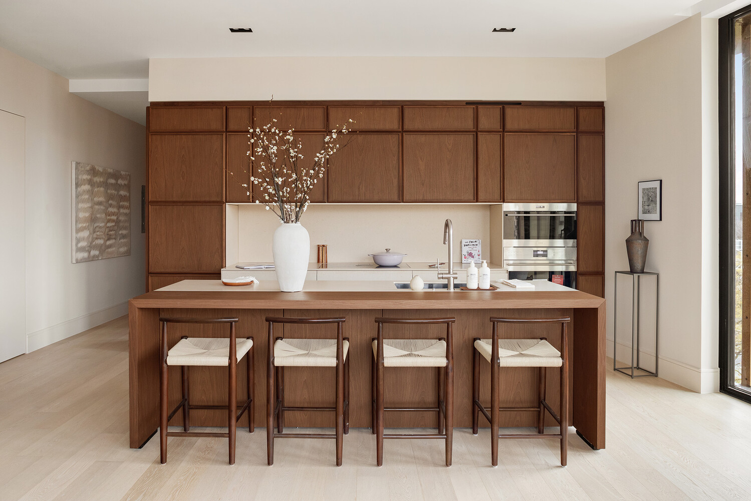 a white kitchen with a sink and cabinets