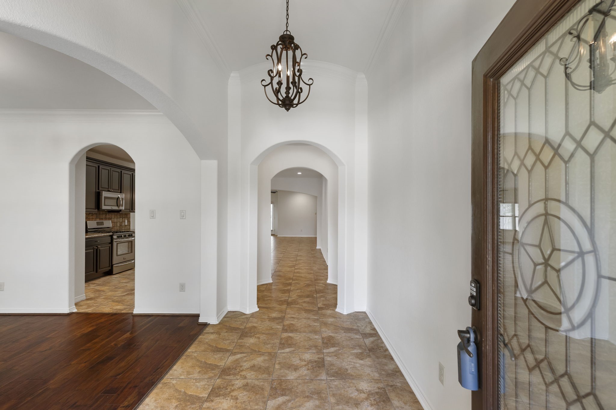 23911 Augusta Falls Lane Spring, TX 77389 - Photo 3 of 40 a view of entryway with chandelier and front door