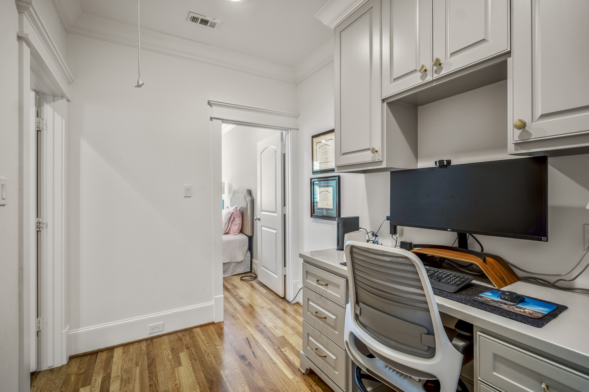 732 East 28th Street Houston, TX 77009 - Photo 27 of 44 a view of a workspace with furniture and wooden floor