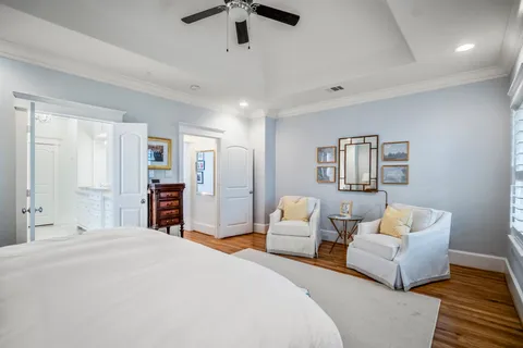 a bedroom with a bed and couch