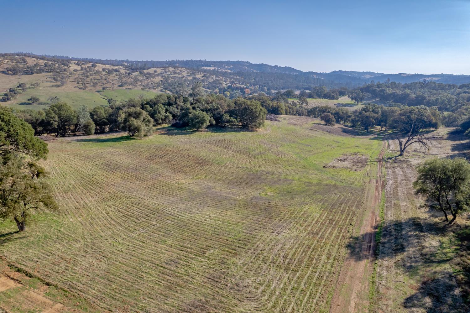 5545 Garden Bar Road Lincoln, CA 95648 - Photo 2 of 32 a view of a lake with mountains in the background