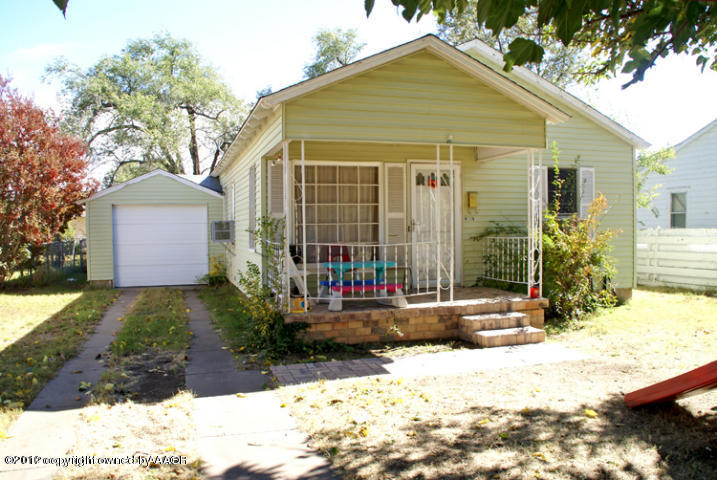 4115 South Ong Street Amarillo, TX 79110 - Photo 1 of 15 a view of house with a yard and outdoor seating
