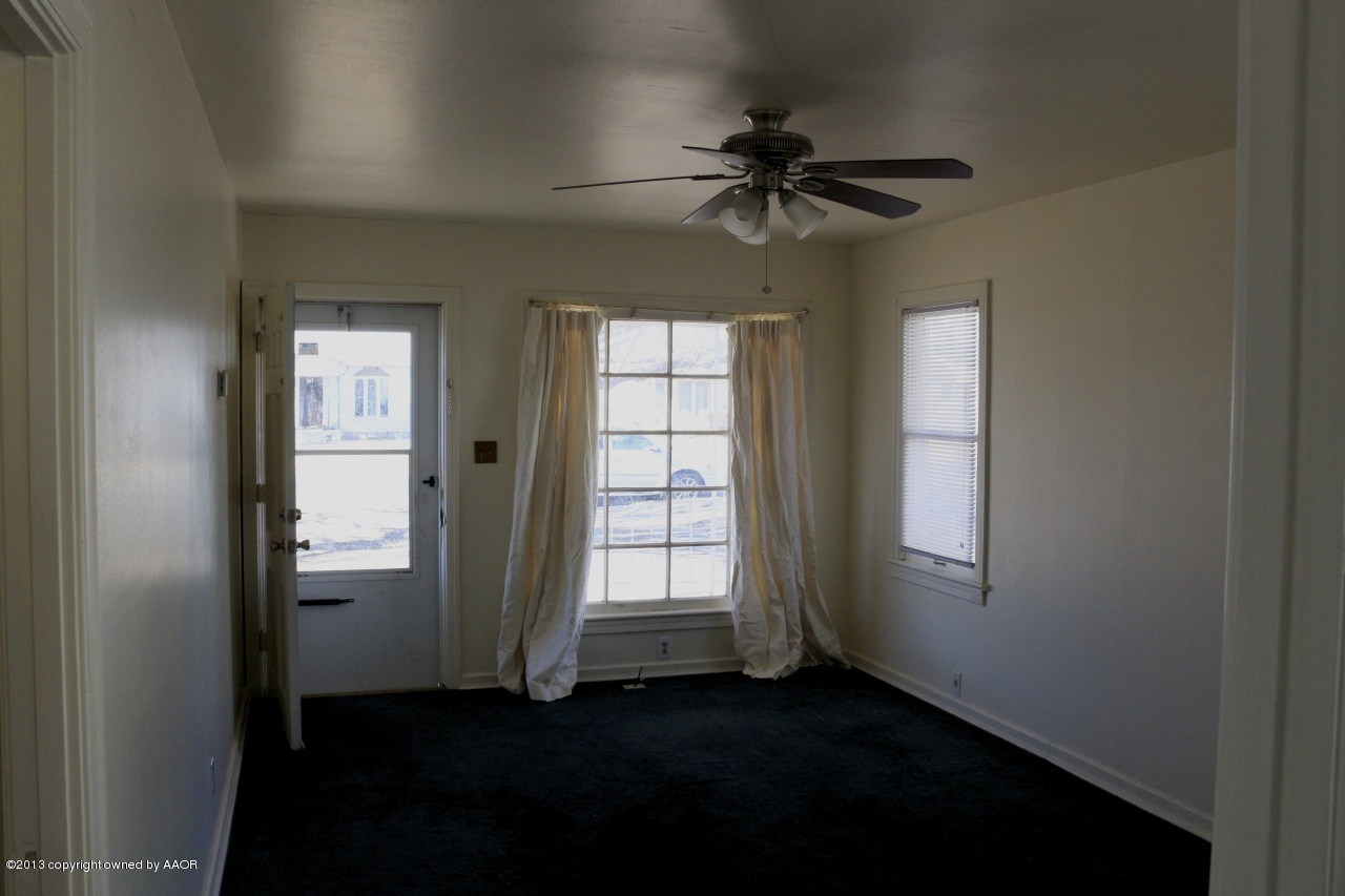 4115 South Ong Street Amarillo, TX 79110 - Photo 4 of 15 a view of empty room with windows