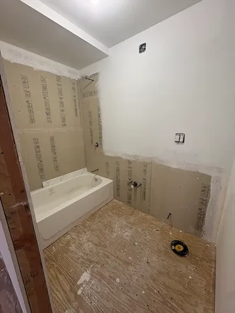 a bathroom with a sink and shower