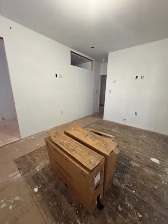 a stove top oven sitting inside of a kitchen