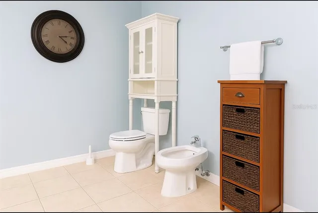 a bathroom with a toilet and a sink