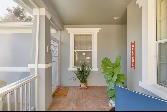 a view of a living room and a potted plant