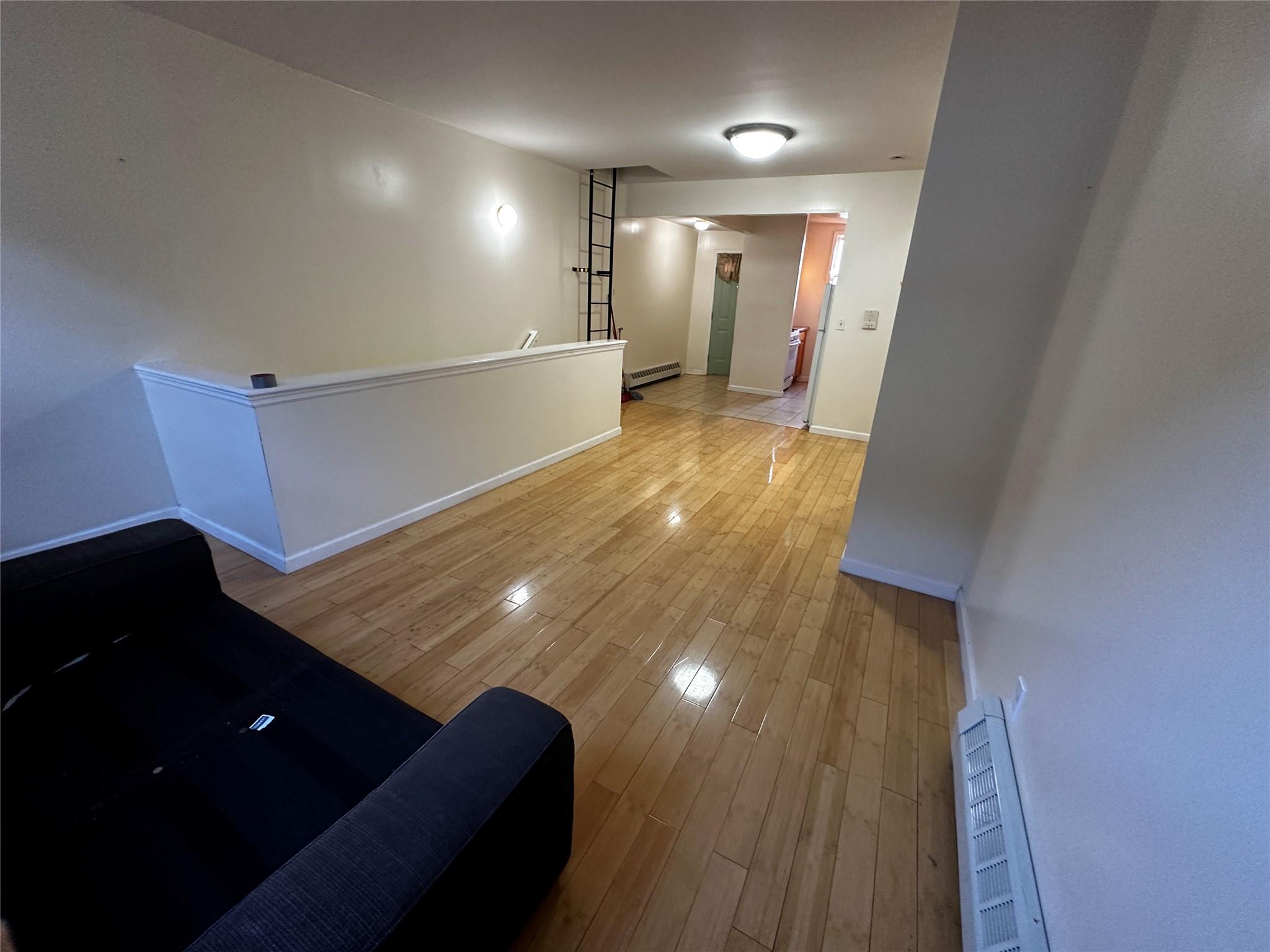 1316 Myrtle Avenue Brooklyn, NY 11221 - Photo 25 of 32 2ND FLRHall featuring light hardwood / wood-style floors and a baseboard heating unit