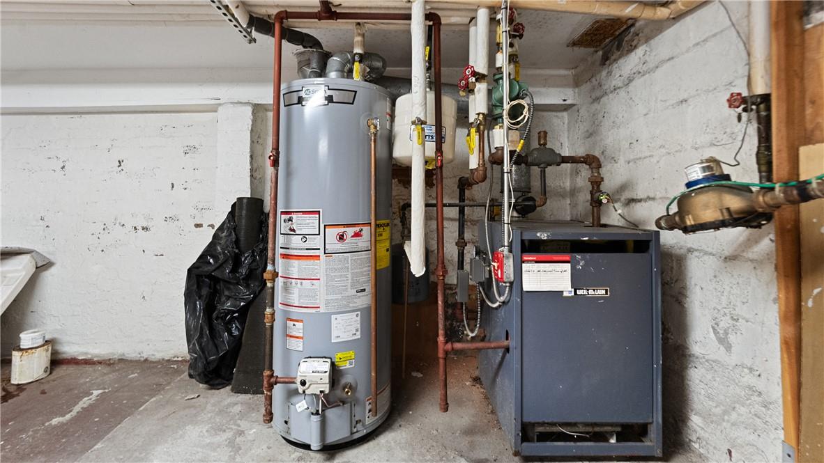 1316 Myrtle Avenue Brooklyn, NY 11221 - Photo 32 of 32 Utility room featuring water heater