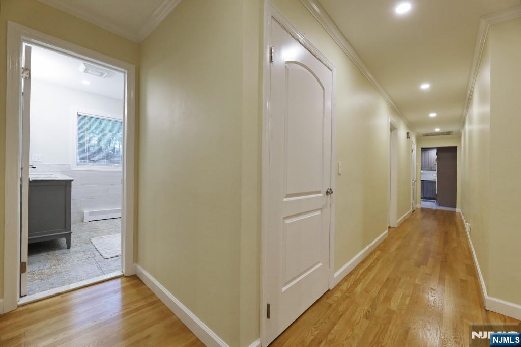 83 Hampshire Road Washington Township, NJ 07676 - Photo 12 of 40 a view of a hallway with wooden floor
