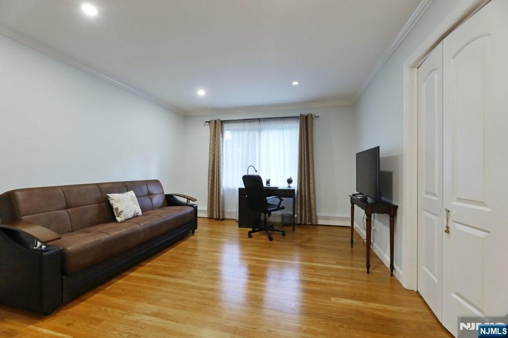 83 Hampshire Road Washington Township, NJ 07676 - Photo 22 of 40 a living room with furniture and a flat screen tv