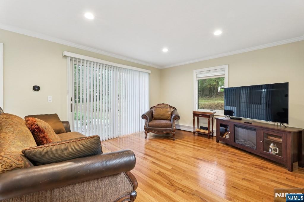 83 Hampshire Road Washington Township, NJ 07676 - Photo 27 of 40 a living room with furniture and a flat screen tv