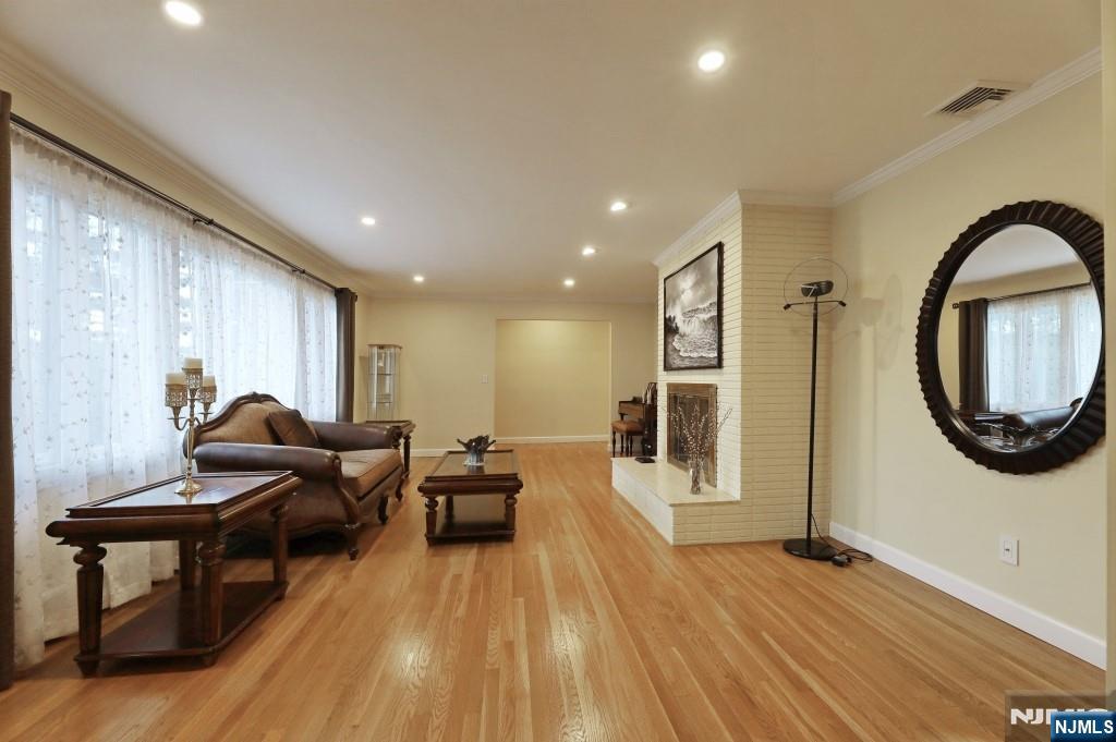 83 Hampshire Road Washington Township, NJ 07676 - Photo 34 of 40 a living room with furniture and a wooden floor