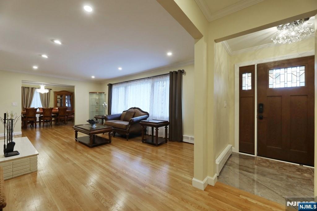 83 Hampshire Road Washington Township, NJ 07676 - Photo 36 of 40 a living room with furniture and a wooden floor