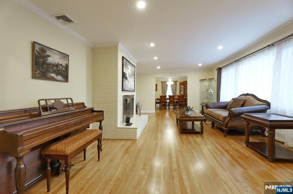 83 Hampshire Road Washington Township, NJ 07676 - Photo 37 of 40 a living room with furniture and a wooden floor