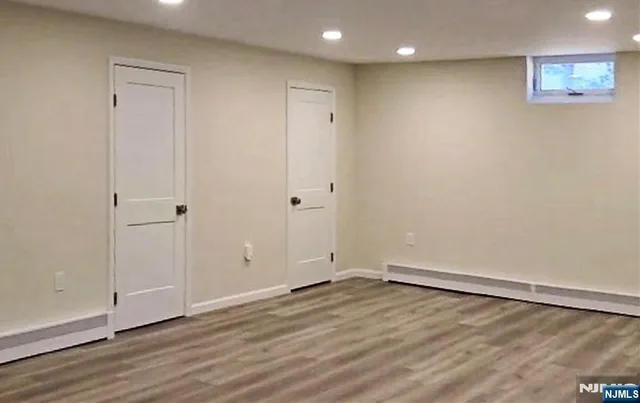 a view of hallway with wooden floor