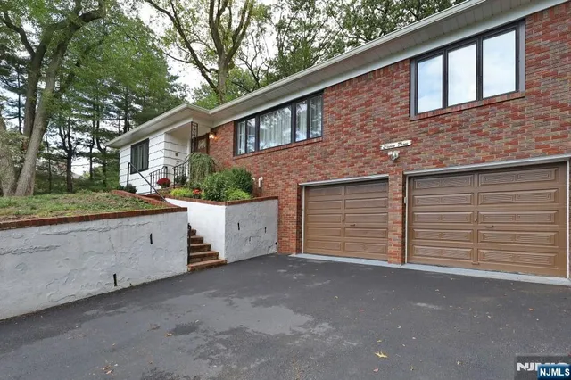 a bedroom with a bed and a mirror