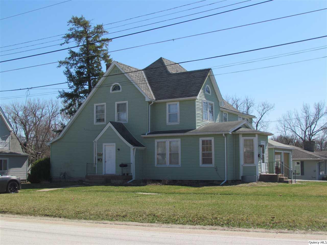 704 Wabash Avenue Carthage, IL 62321 - Photo 1 of 1 a front view of a house with a garden