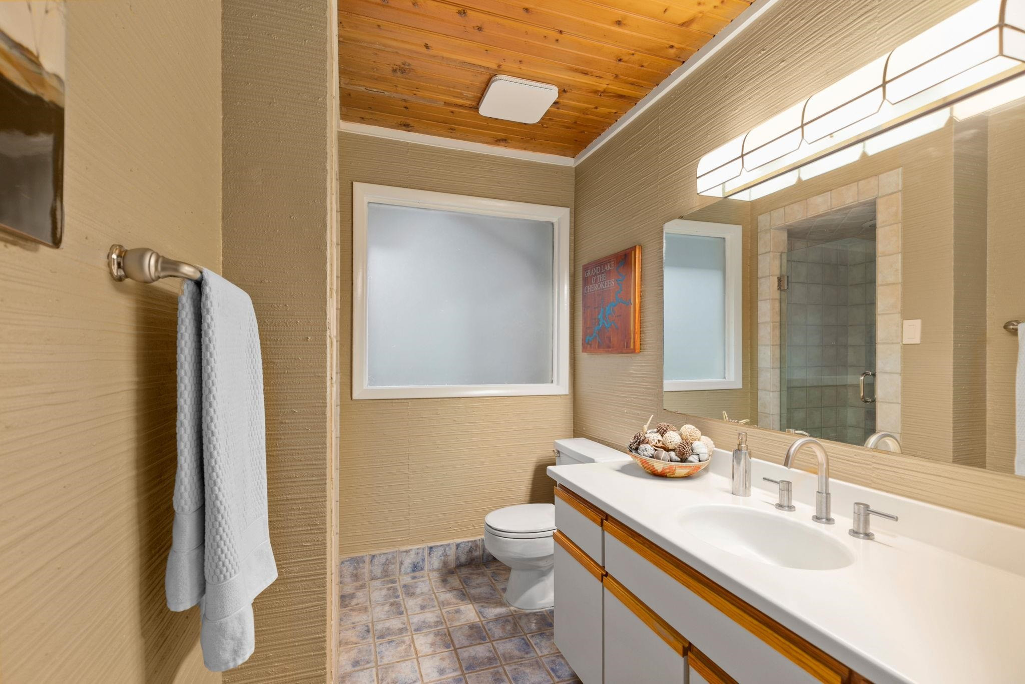 2204 Timberlake Drive Raleigh, NC 27604 - Photo 35 of 100 a bathroom with a sink a toilet and shower