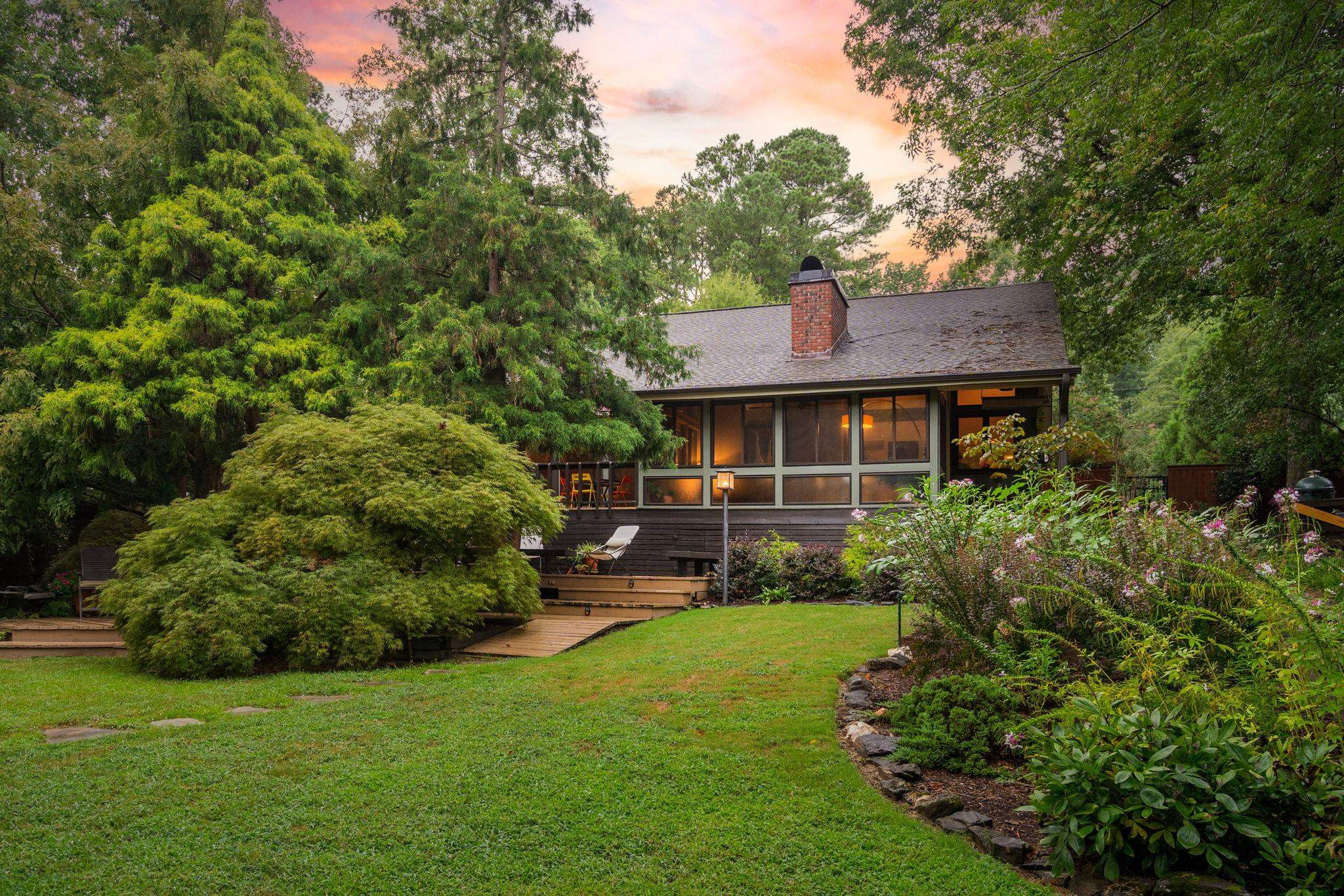 2204 Timberlake Drive Raleigh, NC 27604 - Photo 54 of 100 a front view of a house with a yard and green space