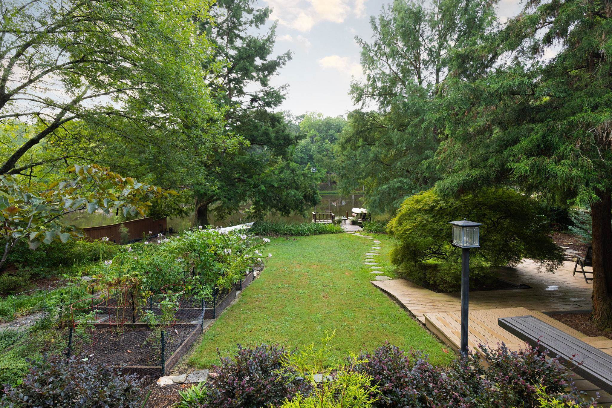 2204 Timberlake Drive Raleigh, NC 27604 - Photo 73 of 100 a view of a garden with a bench