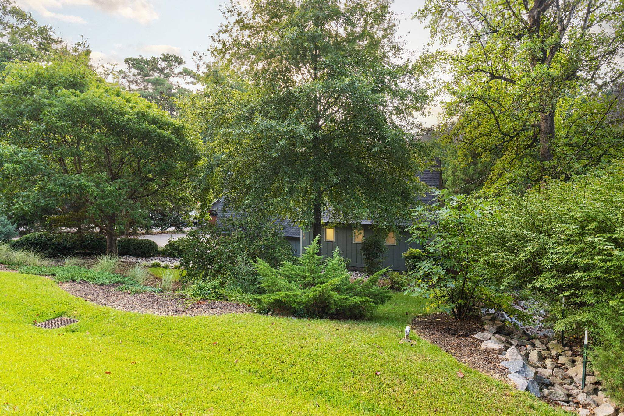 2204 Timberlake Drive Raleigh, NC 27604 - Photo 84 of 100 a view of a garden with a bench