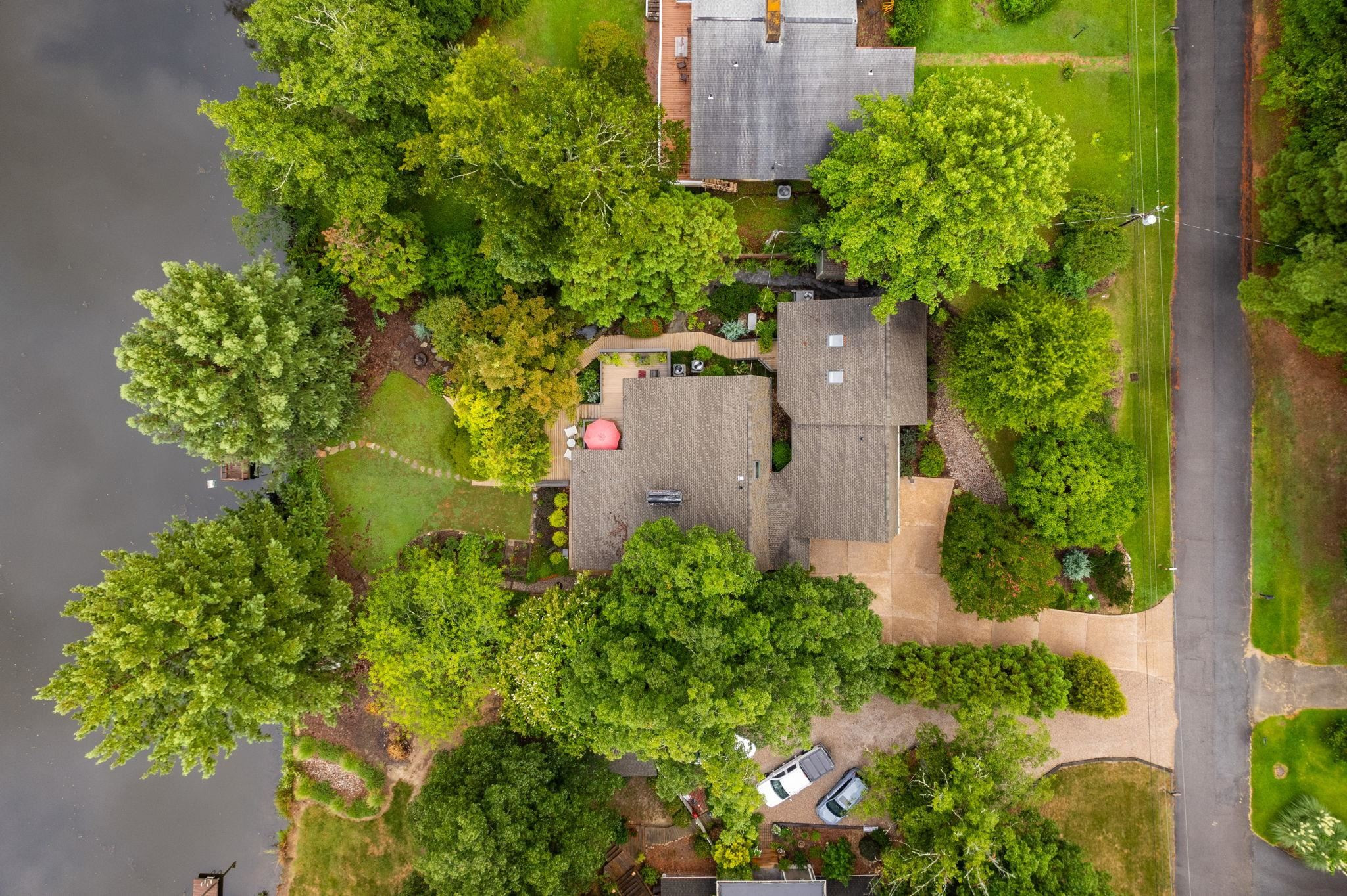 2204 Timberlake Drive Raleigh, NC 27604 - Photo 91 of 100 an aerial view of a house with a yard and garden