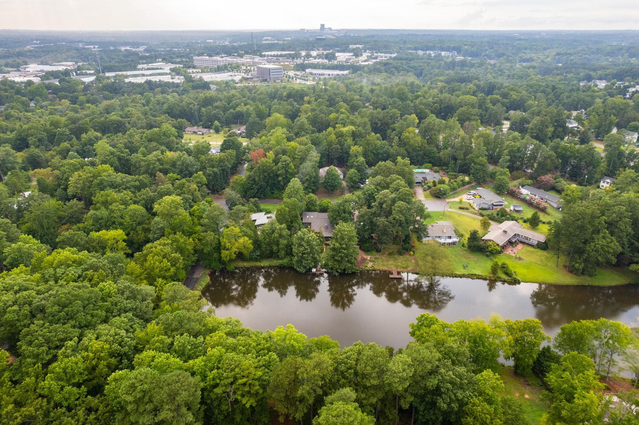 2204 Timberlake Drive Raleigh, NC 27604 - Photo 96 of 100 an aerial view of lake residential house with swimming pool and green space