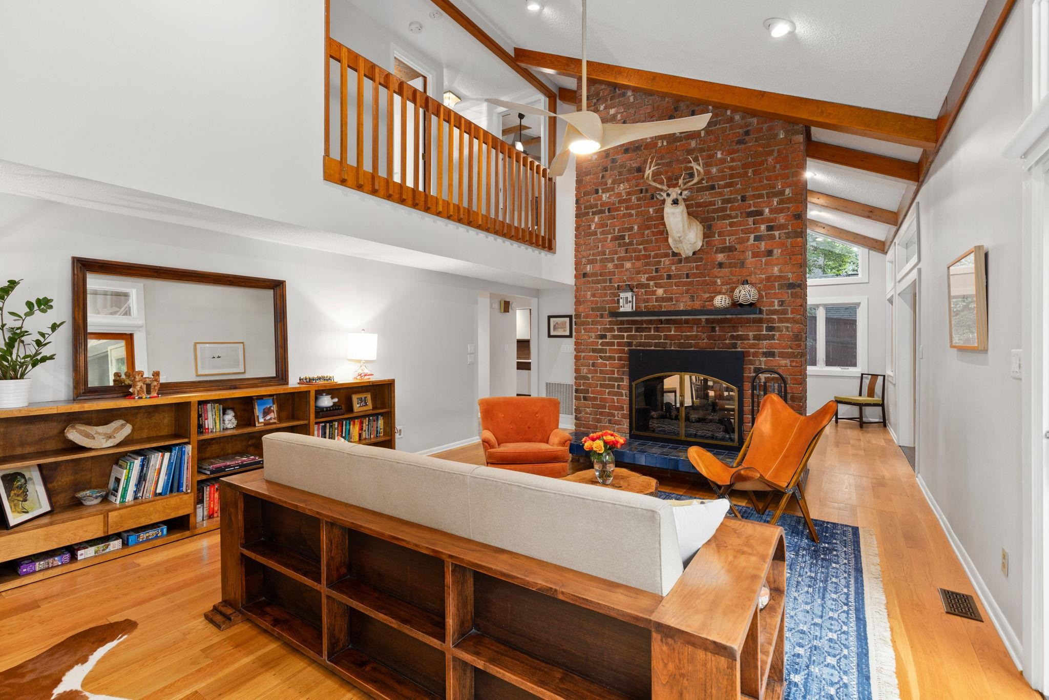 2204 Timberlake Drive Raleigh, NC 27604 - Photo 10 of 100 a living room with furniture a fireplace and a wooden floor