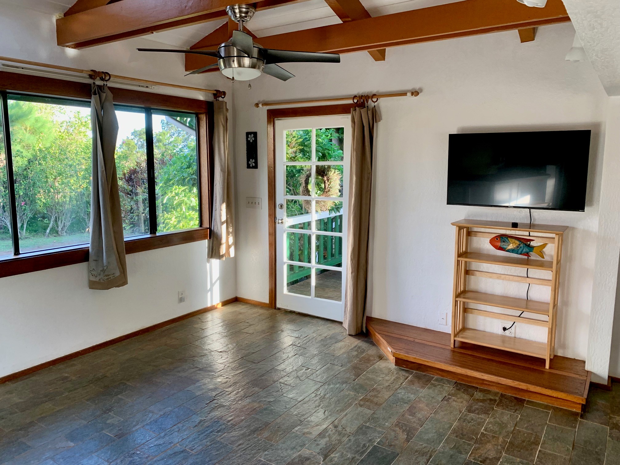3198 Wawae Road Kalaheo, HI 96741 - Photo 13 of 30 a view of room with window and flat screen tv