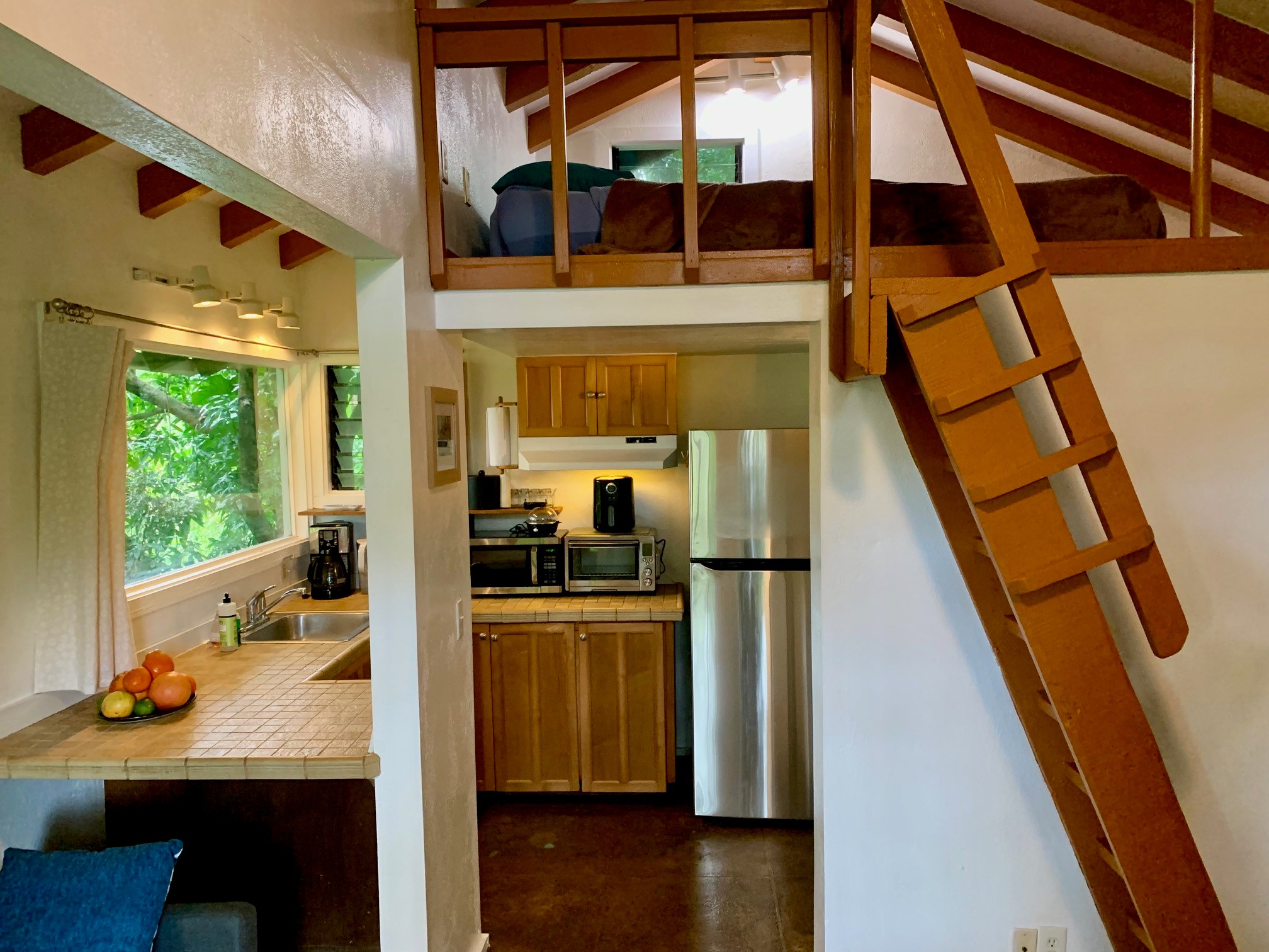 3198 Wawae Road Kalaheo, HI 96741 - Photo 17 of 30 a very nice looking room with wooden floor and windows