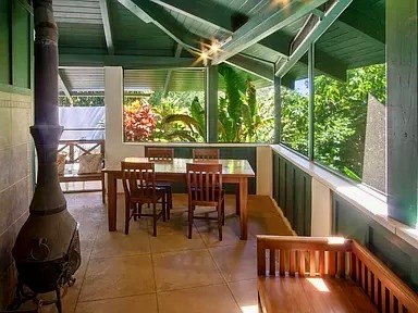 3198 Wawae Road Kalaheo, HI 96741 - Photo 6 of 30 a view of a porch with chairs and backyard