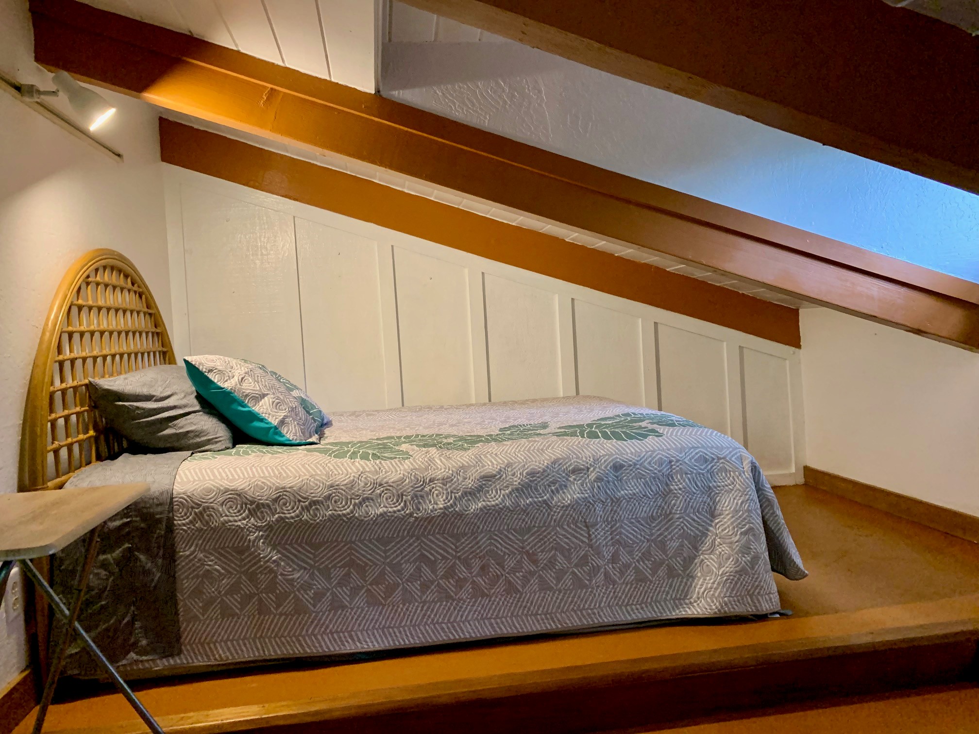 3198 Wawae Road Kalaheo, HI 96741 - Photo 9 of 30 a bed sitting in a bedroom next to a cabinet