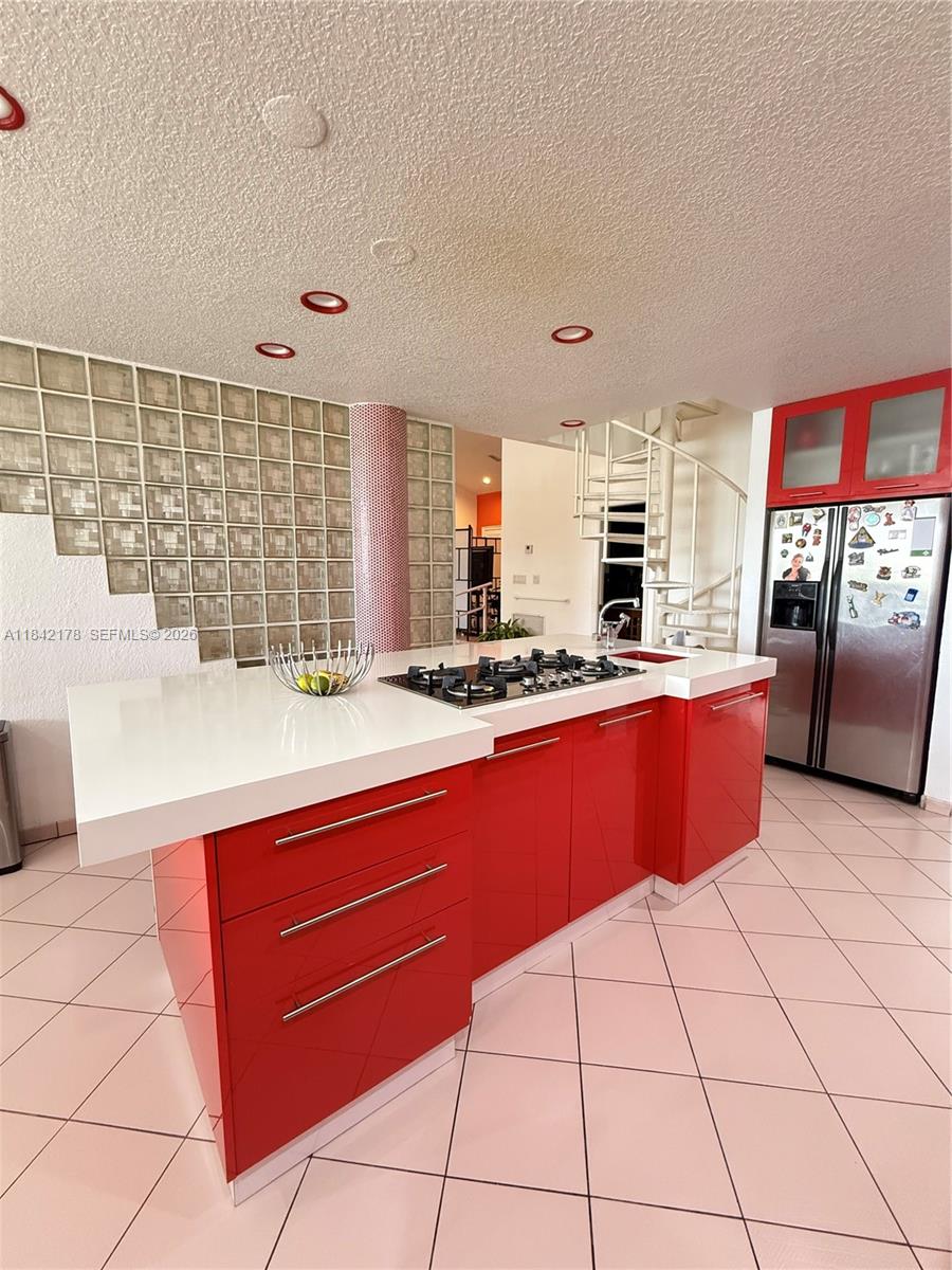 747 West 78th Street Hialeah, FL 33014 - Photo 11 of 37 a kitchen with stainless steel appliances kitchen island granite countertop a sink and cabinets