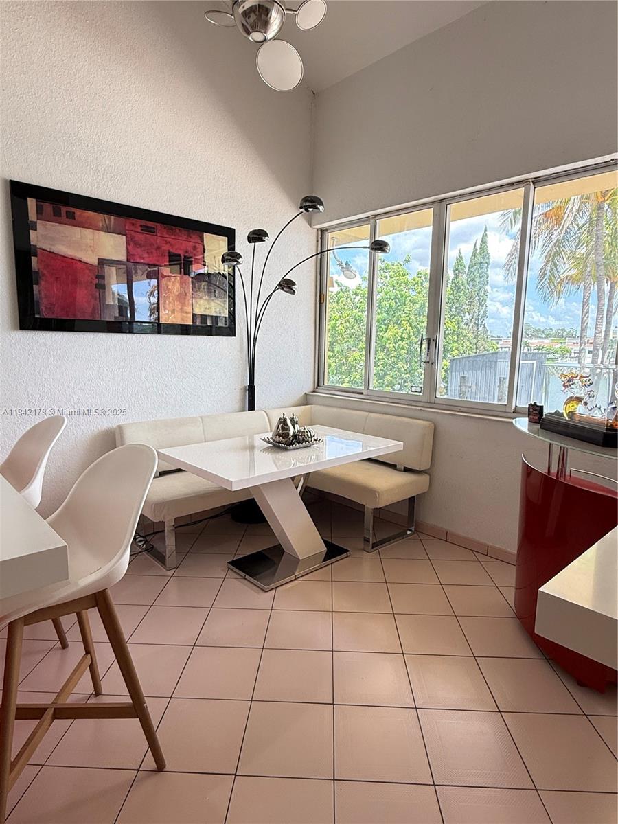 747 West 78th Street Hialeah, FL 33014 - Photo 12 of 38 a living room with furniture and a large window