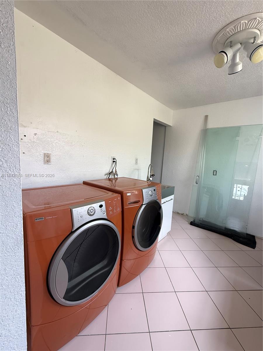 747 West 78th Street Hialeah, FL 33014 - Photo 14 of 37 a view of a washer and dryer in a room
