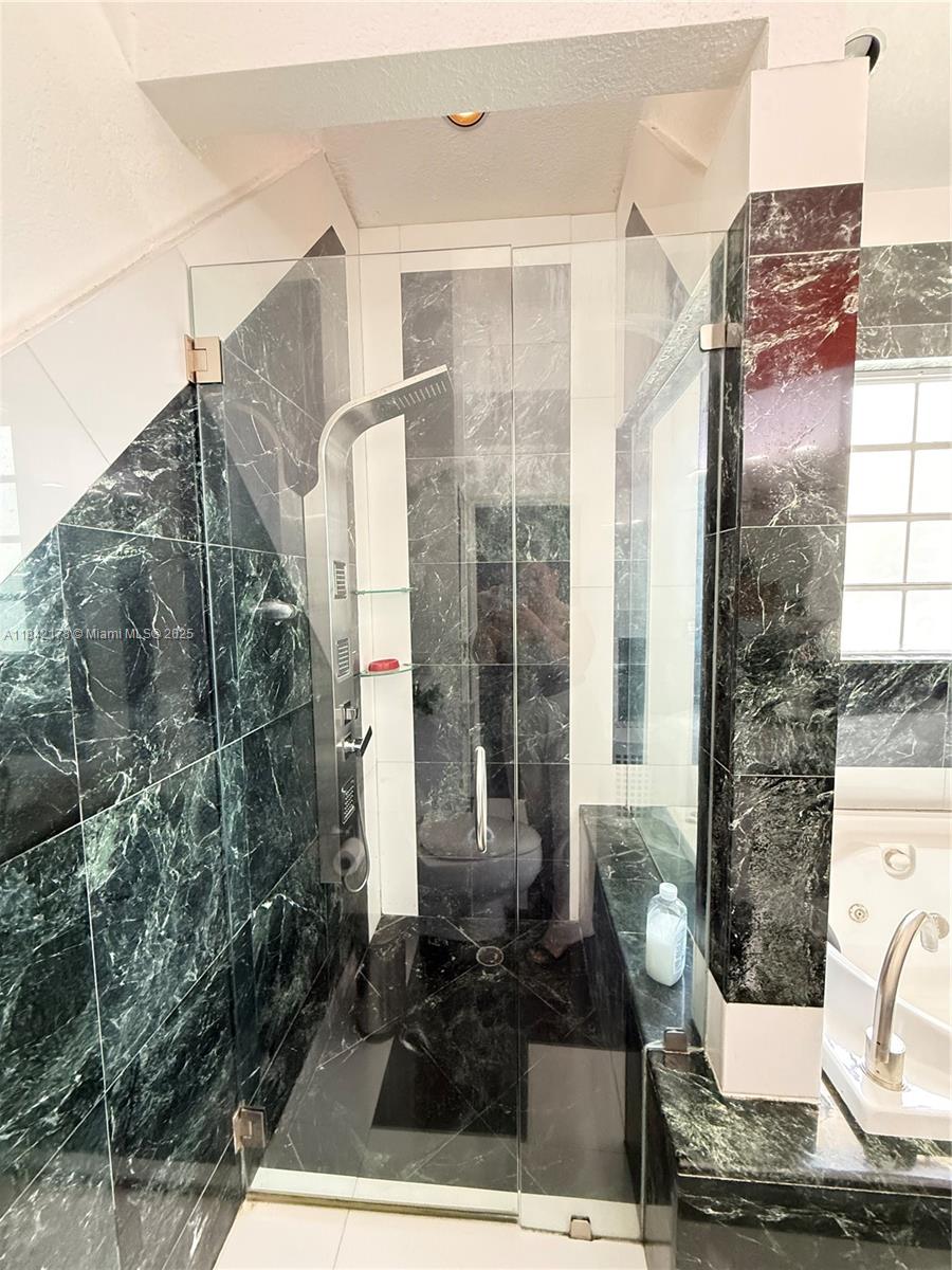 747 West 78th Street Hialeah, FL 33014 - Photo 19 of 38 a front view of a house with a yard