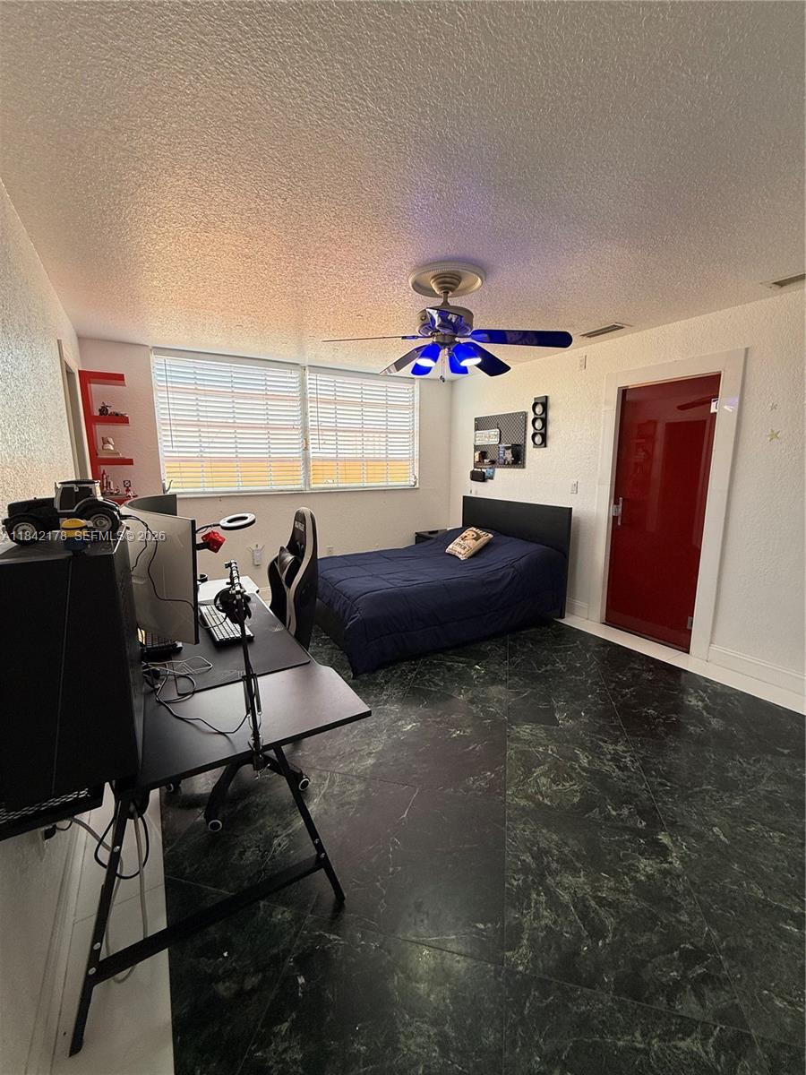 747 West 78th Street Hialeah, FL 33014 - Photo 20 of 37 a bedroom with furniture and a window
