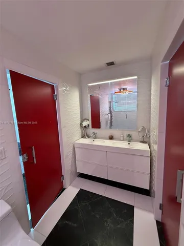 a room with furniture and mirror