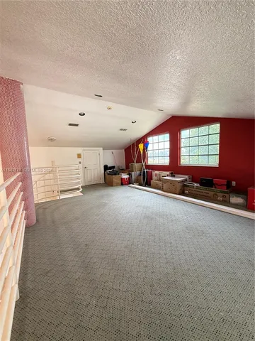 a view of a livingroom with furniture and a window