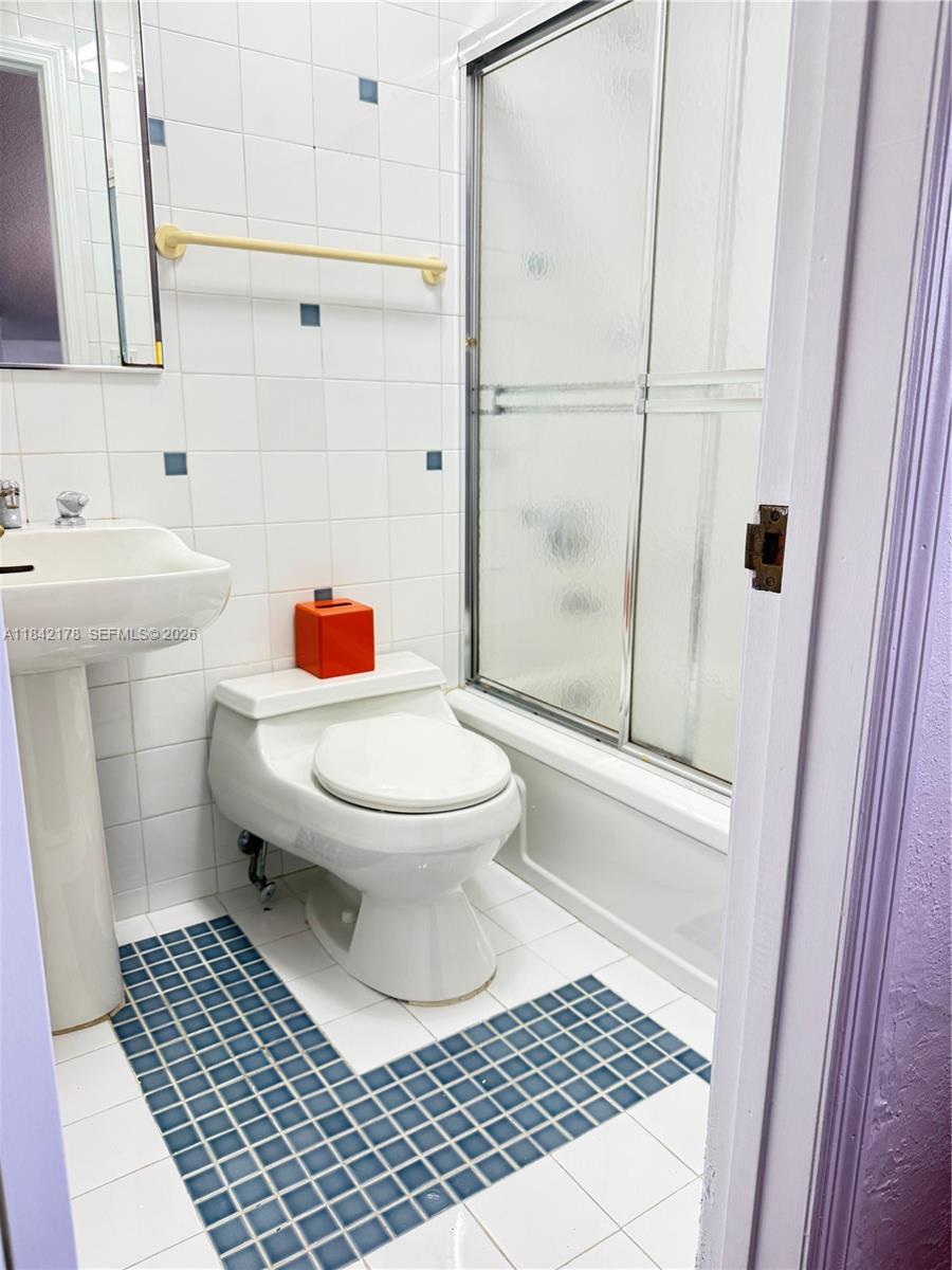 747 West 78th Street Hialeah, FL 33014 - Photo 27 of 37 a bathroom with a toilet and a shower