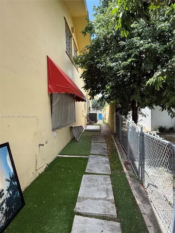 a house view with a backyard space