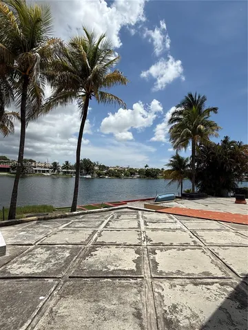 a view of swimming pool with a yard
