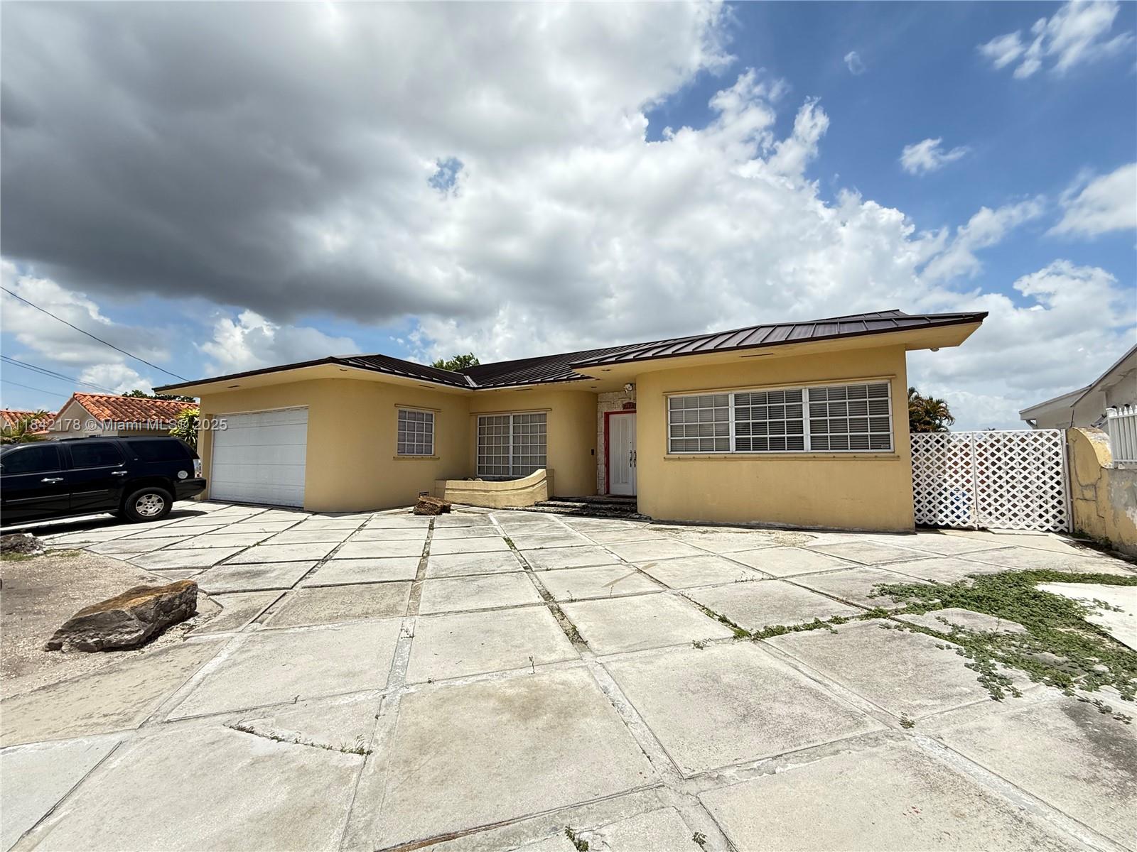 747 West 78th Street Hialeah, FL 33014 - Photo 38 of 38 a front view of a house with a yard