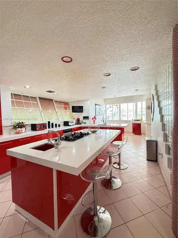 a room with furniture and air hockey table